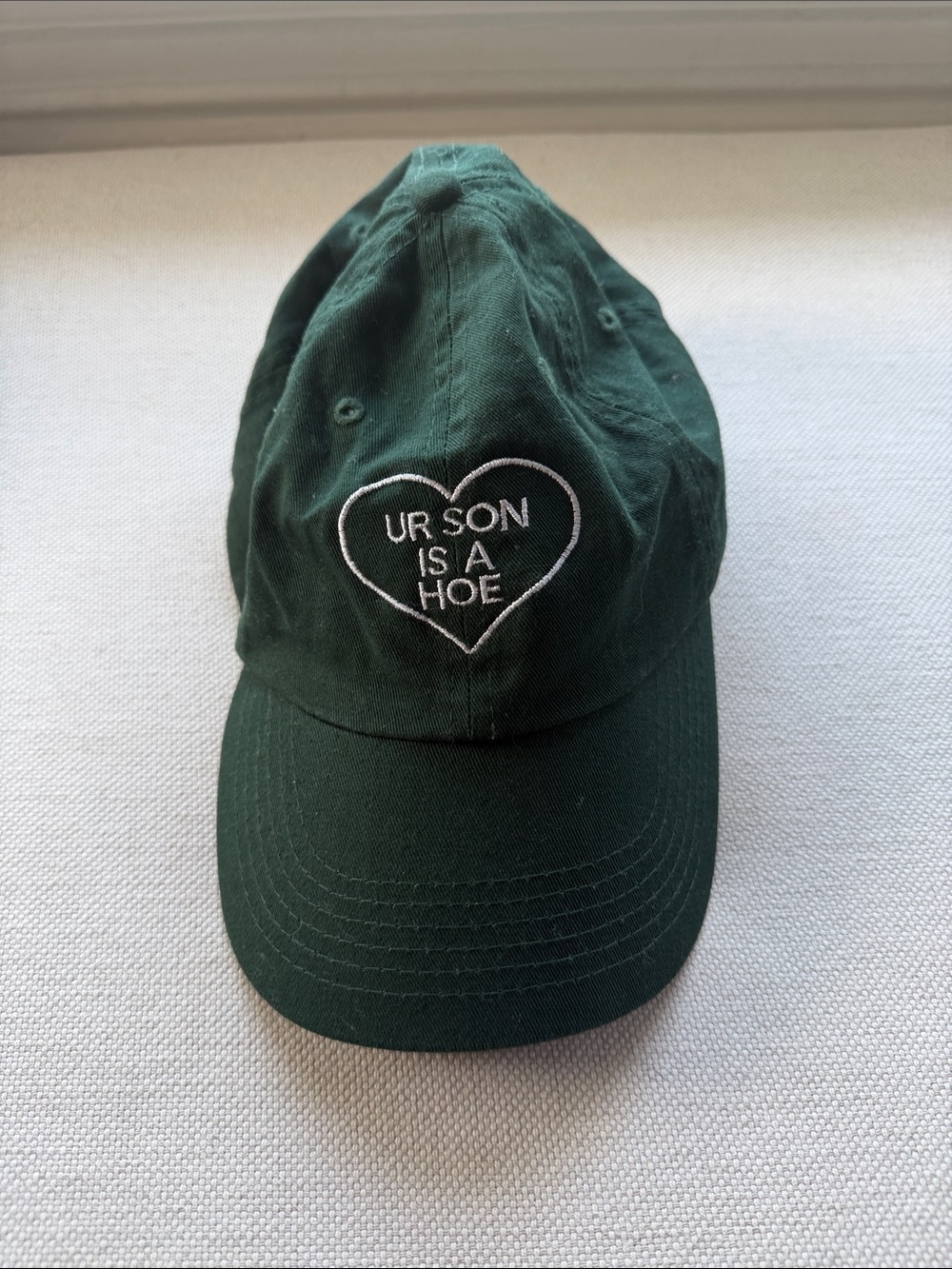 Dark Green Embroidered Heart Cap - 'UR SON IS A H*'